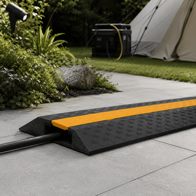 Cable Protector Ramp 1m — Heavy rubber ramp that protects a cable underfoot at events.
